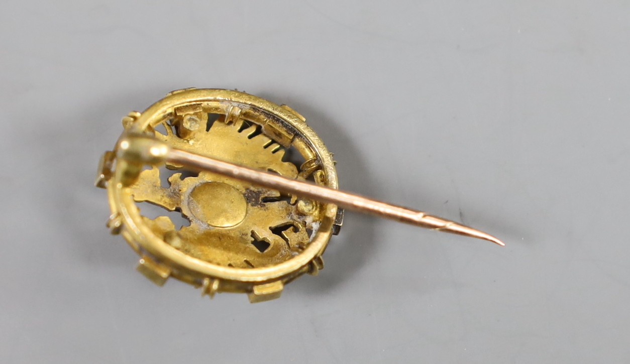 An early 20th century yellow metal, red cabochon and rose cut diamond cluster set short stick pin, with oval terminal, 31mm, gross weight 5.4 grams.